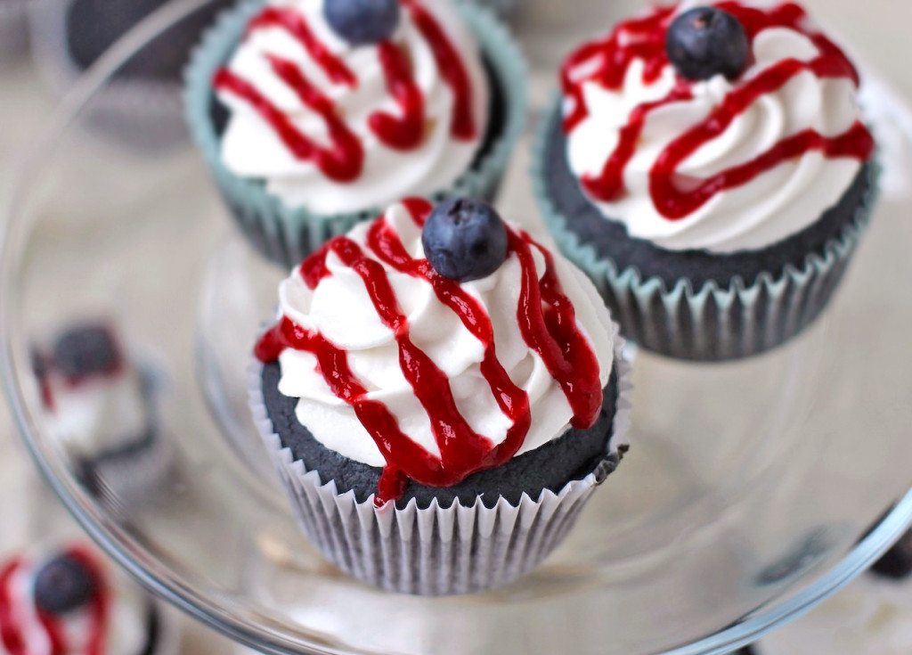 Blue Velvet Cupcakes with White Coconut Frosting and Strawberry Syrup Drizzle