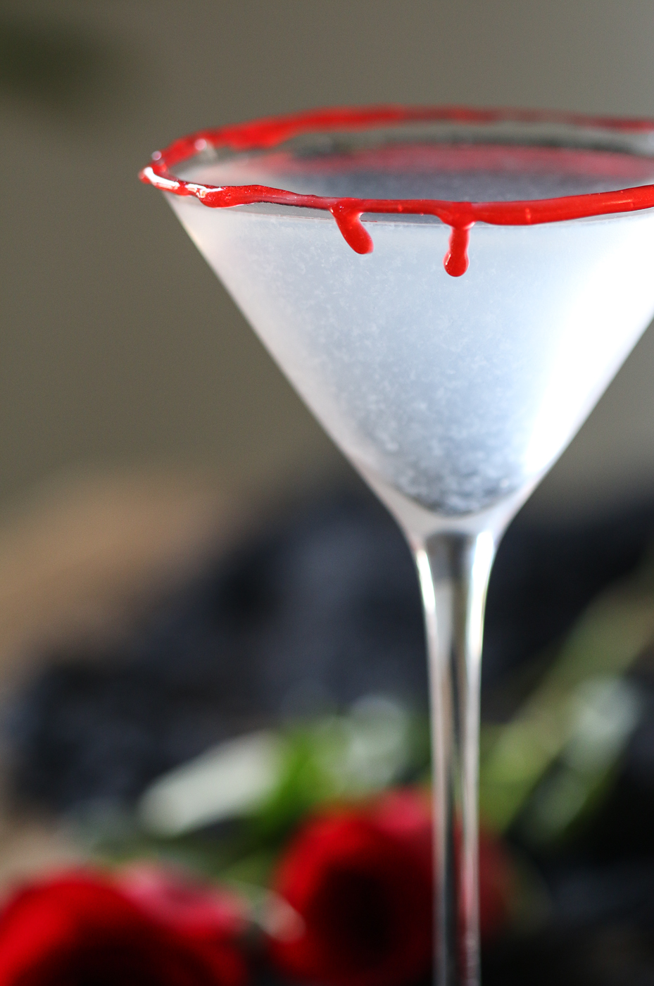 Blood rimmed Halloween cocktail glass and roses