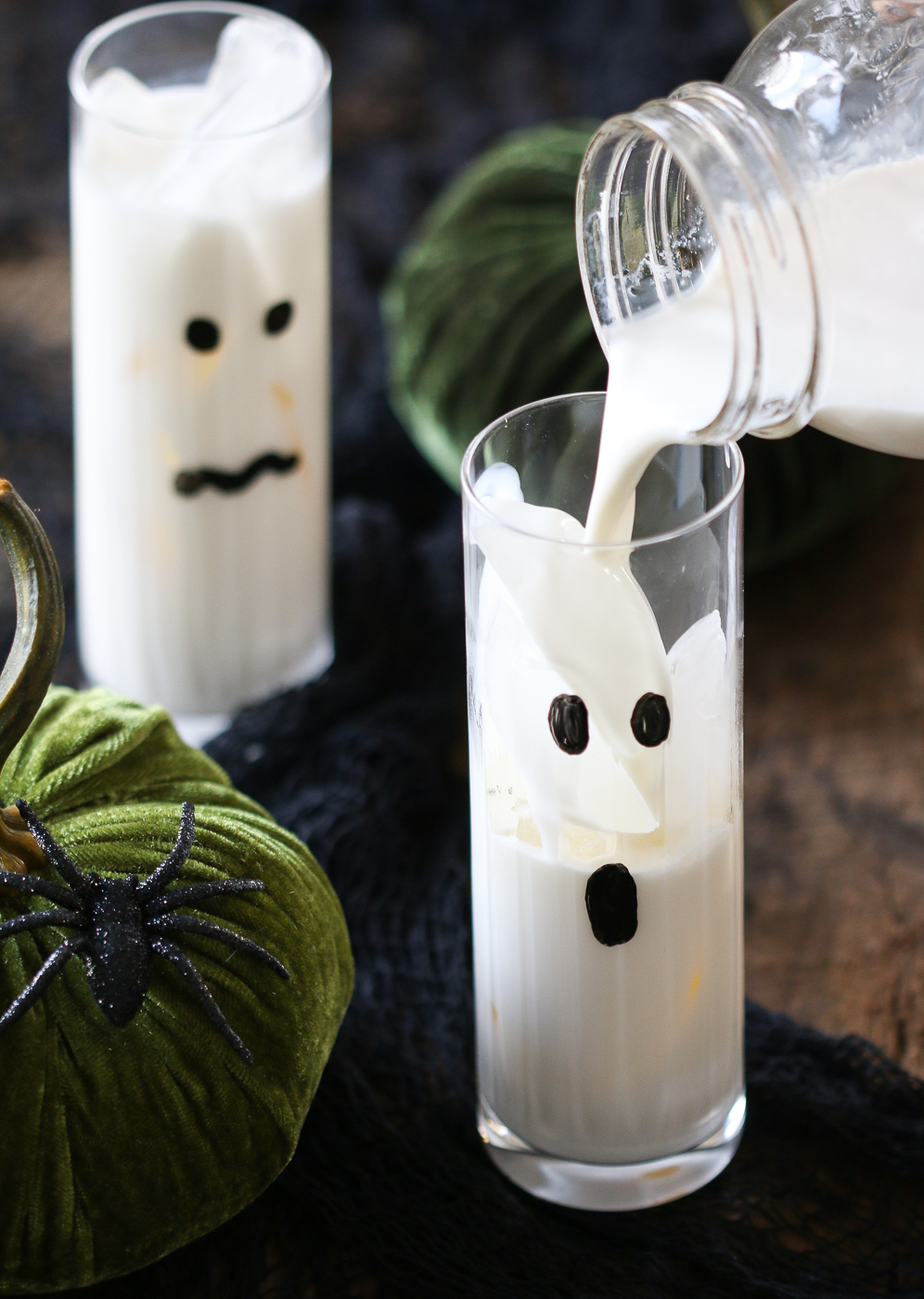 pouring Halloween cocktail into highball