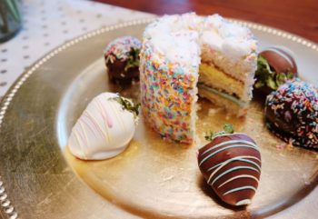 birthday cake and strawberries on platter e1477004199316