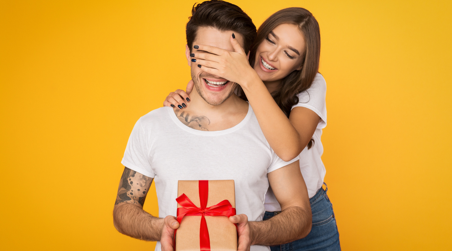 woman giving man gift