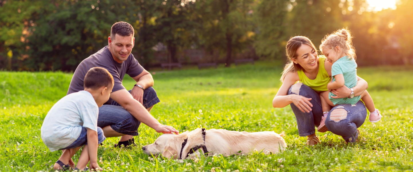 Family Outside With Dog