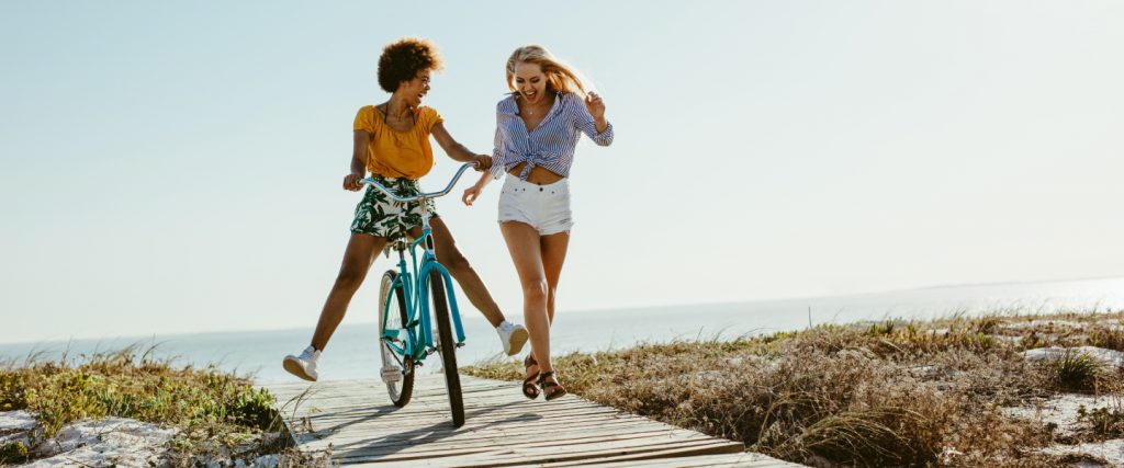 girl on bike and friend