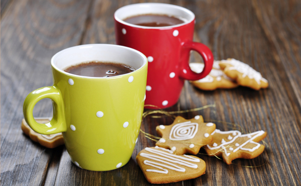 hot cocoa and cookies Two mugs of hot chocolate on wooden table with gingerbread cookies