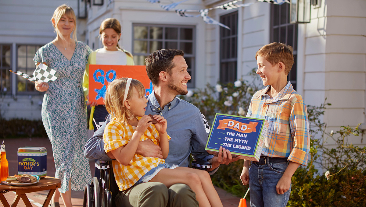 last minute fathers day gift ideas dad in wheelchair surrounded by his children